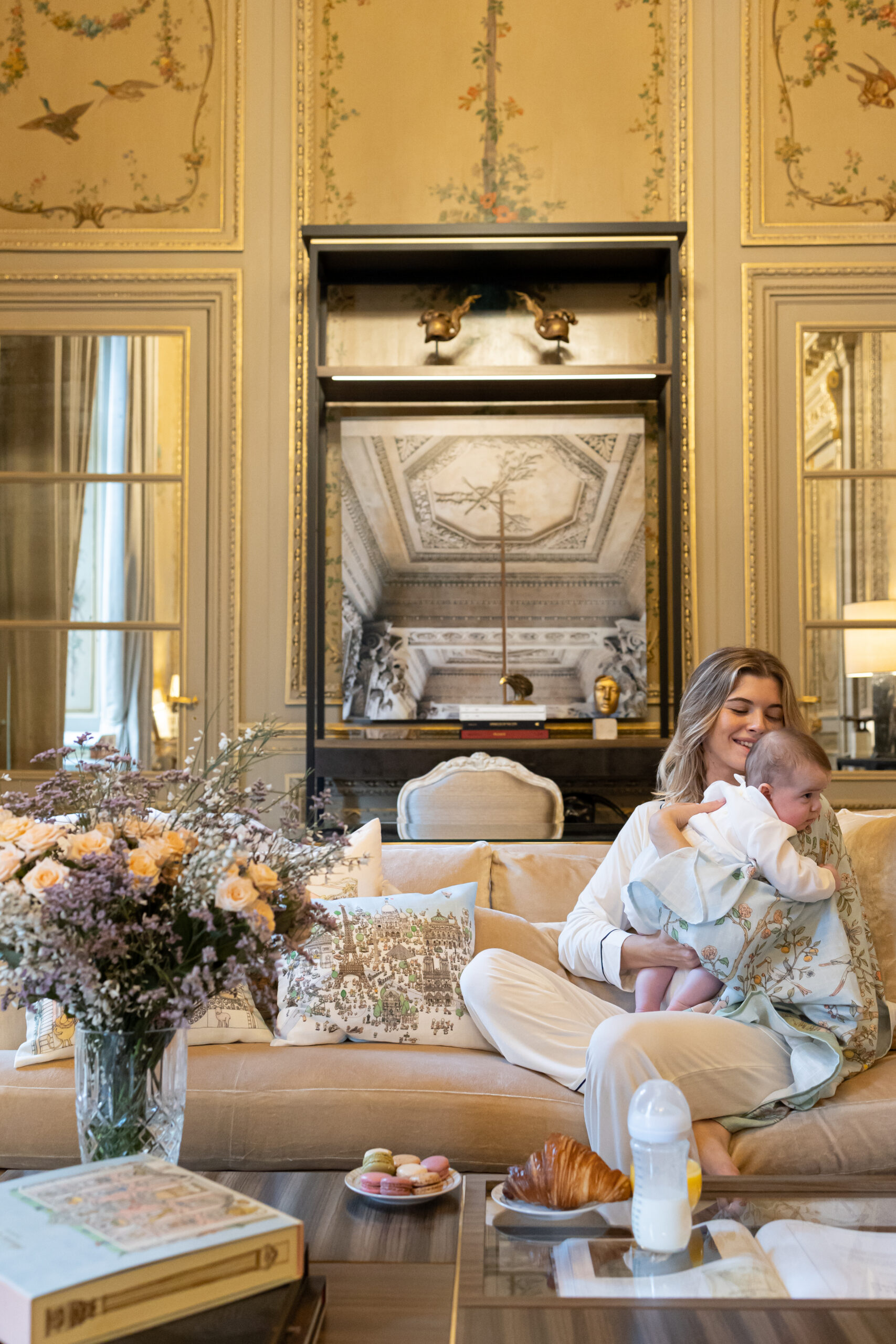 Atelier Choux blanket on French mom holding baby in Hôtel de Crillon in Paris France